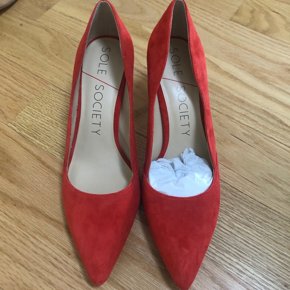 Red suede pumps